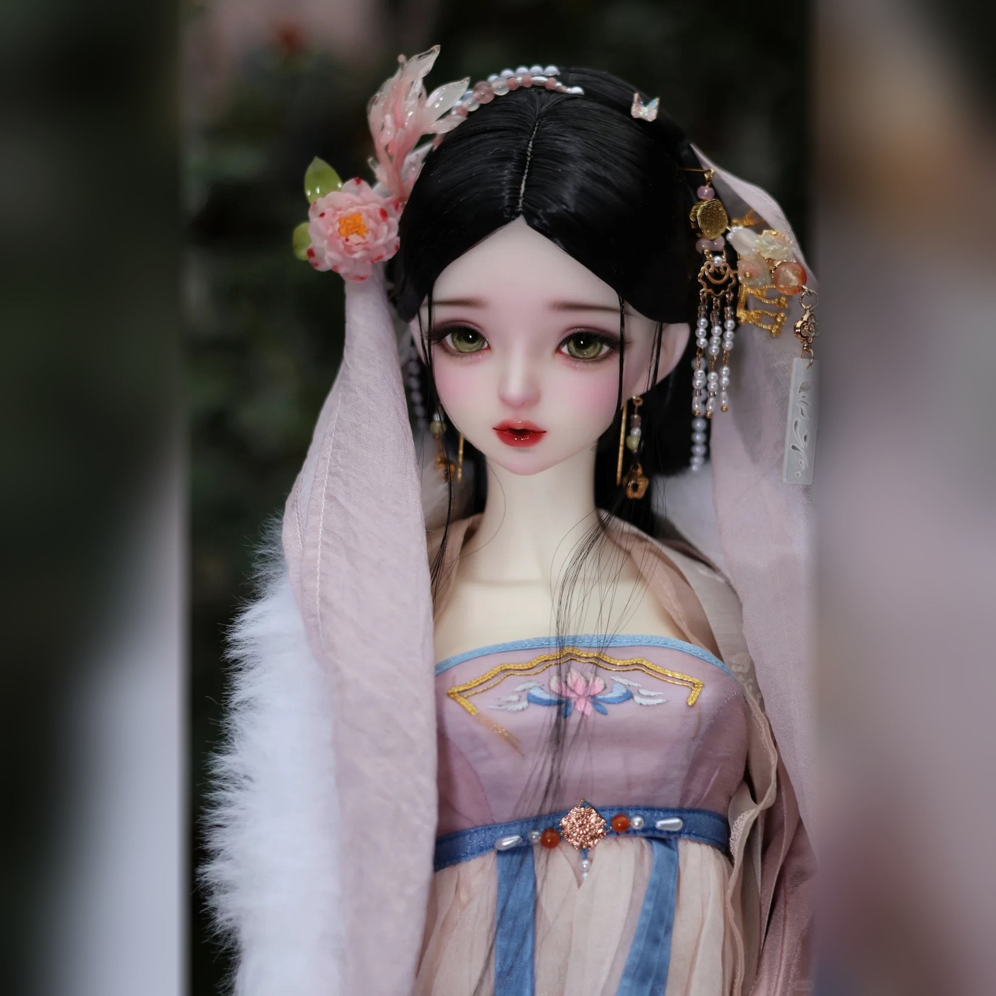 BJD styling example with face-up, green eyes and traditional Chinese hair accessories