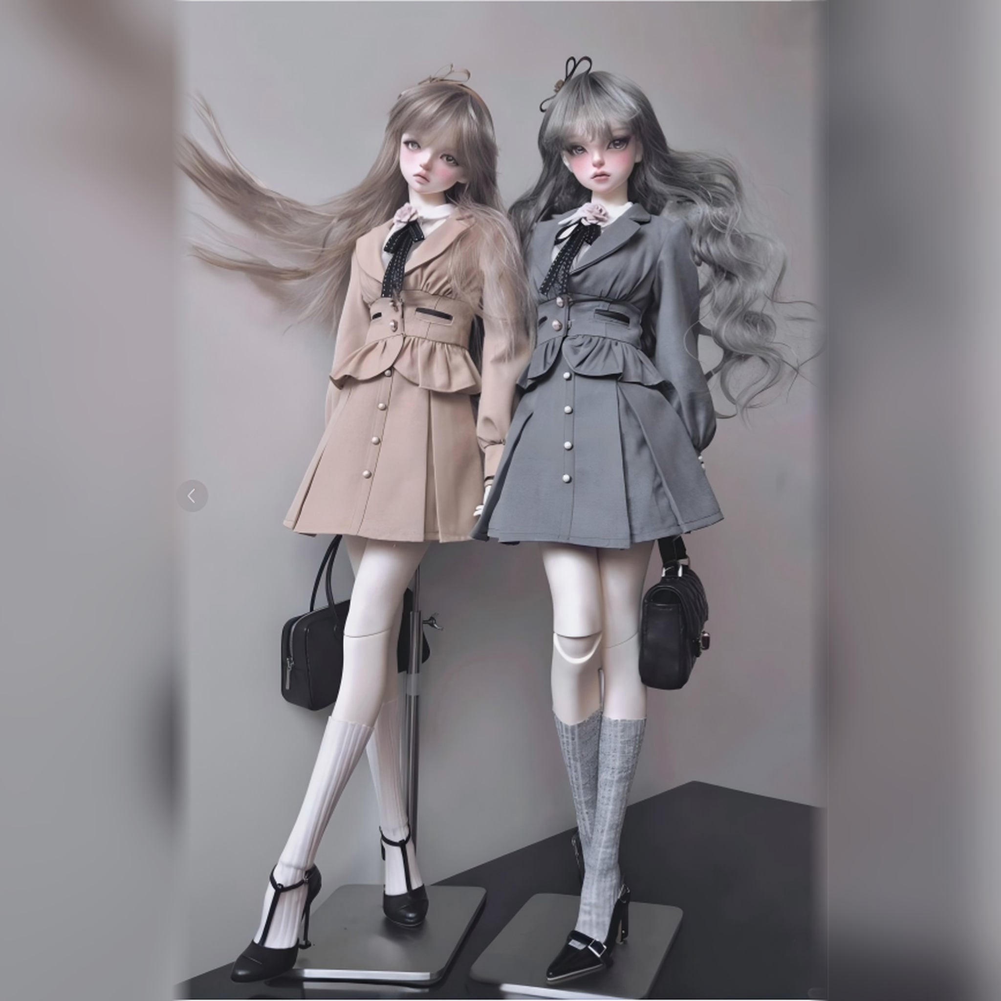 BJD dolls wearing detailed outfits displayed in a studio setting