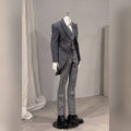 Styled 1/4 scale male BJD body wearing a tailored gray suit and dress shoes