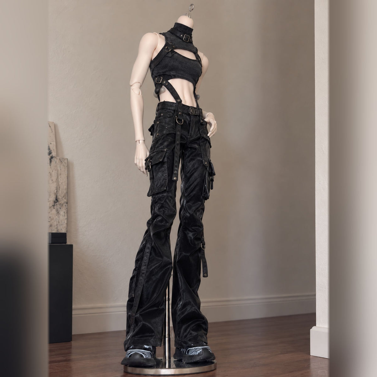 Styled 1/4 scale male BJD body wearing black harness top and cargo pants
