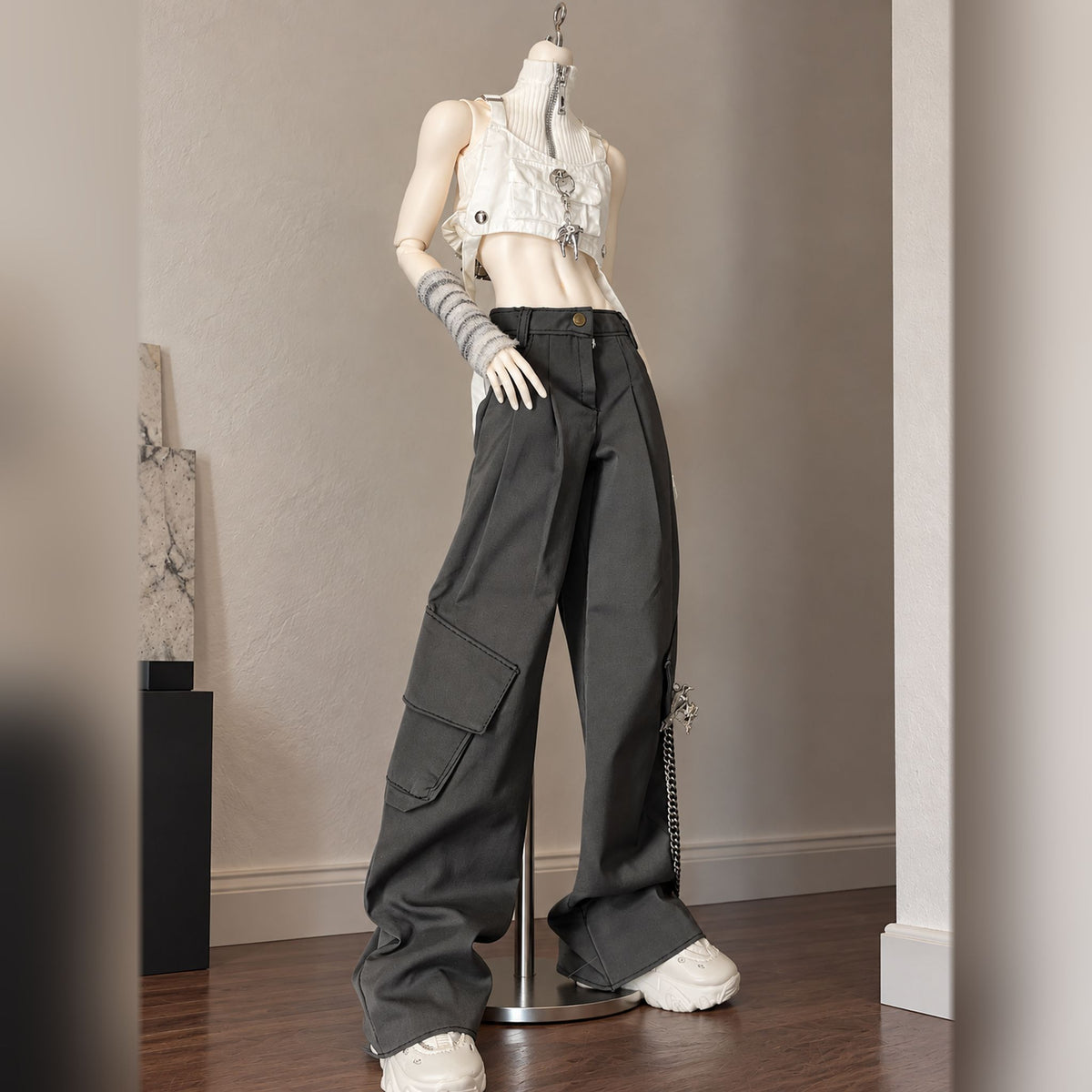 Slim male BJD body styled with a white cropped vest and wide-leg trousers