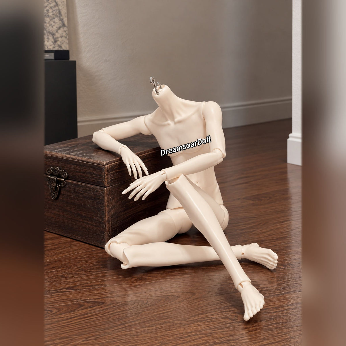 Male resin BJD body in a relaxed floor pose showing full joint flexibility