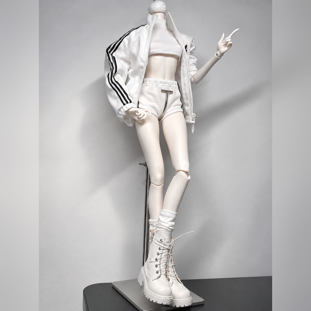 Female BJD body fashion pose in white sportswear showing leg articulation and poseability