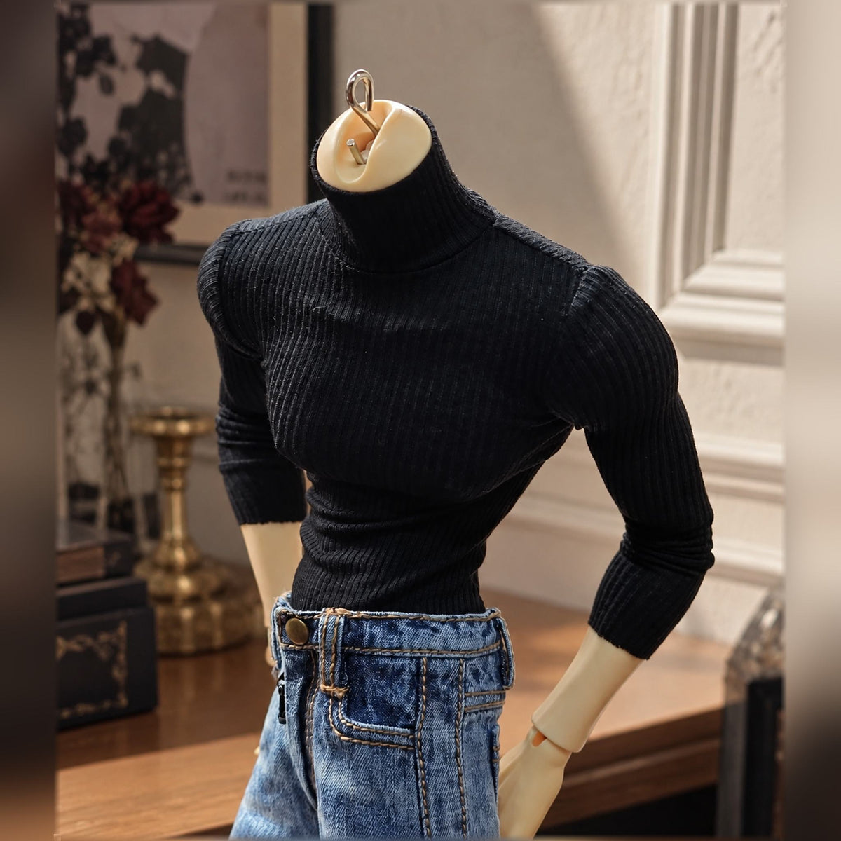 Broad-shouldered male BJD body wearing a fitted black top and blue jeans