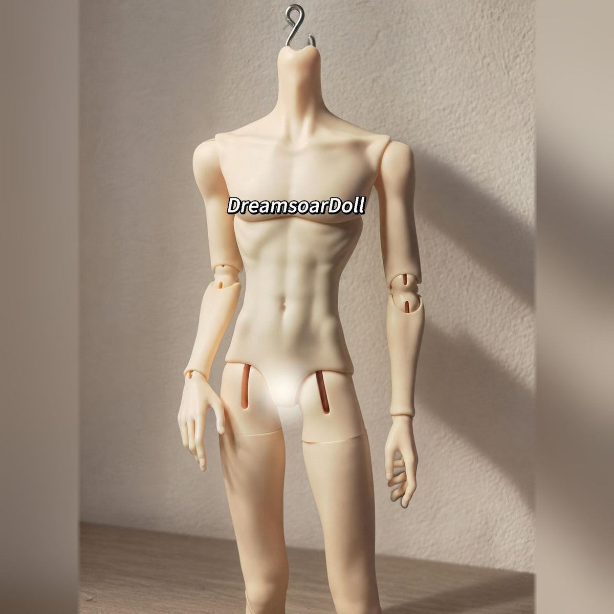 Close-up of a slim male resin BJD body with defined torso and articulated arms