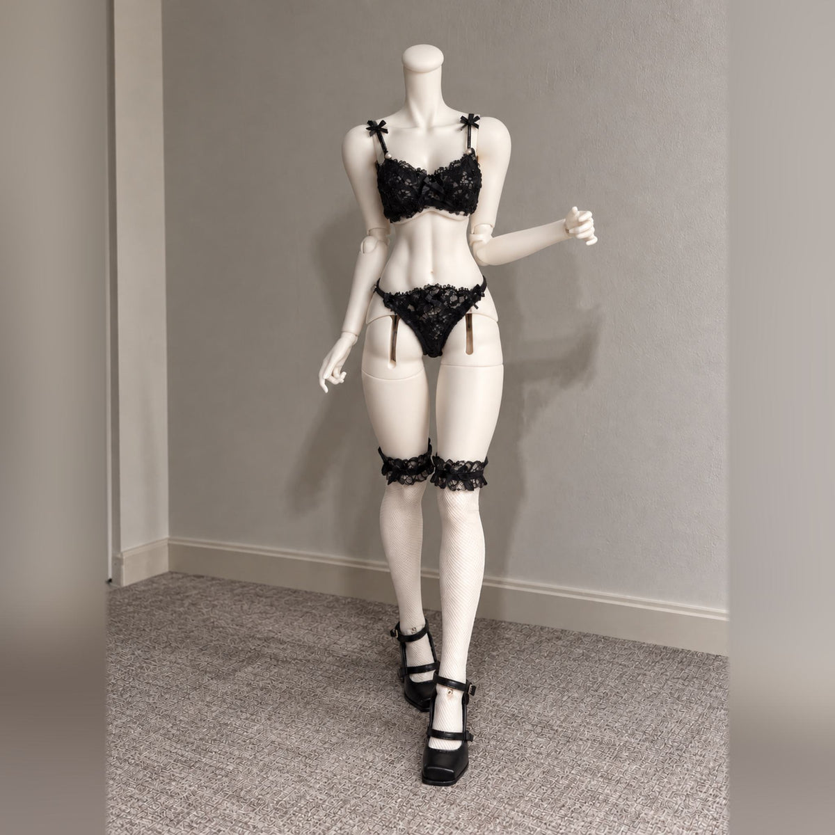 Full view of a curvy female BJD body styled in black lace lingerie and stockings