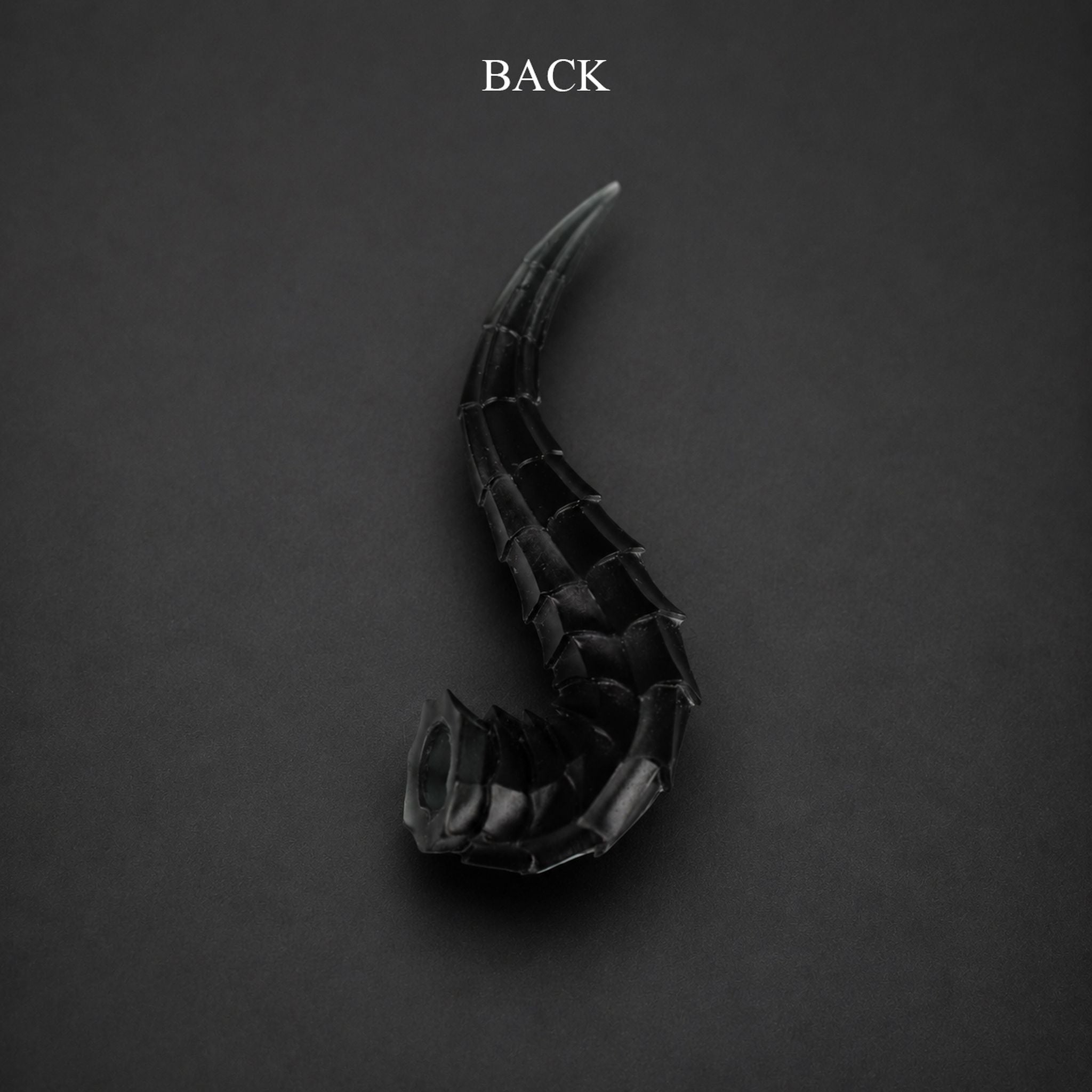 BJD doll dragon horns accessory back view, black curved horns with segmented texture design