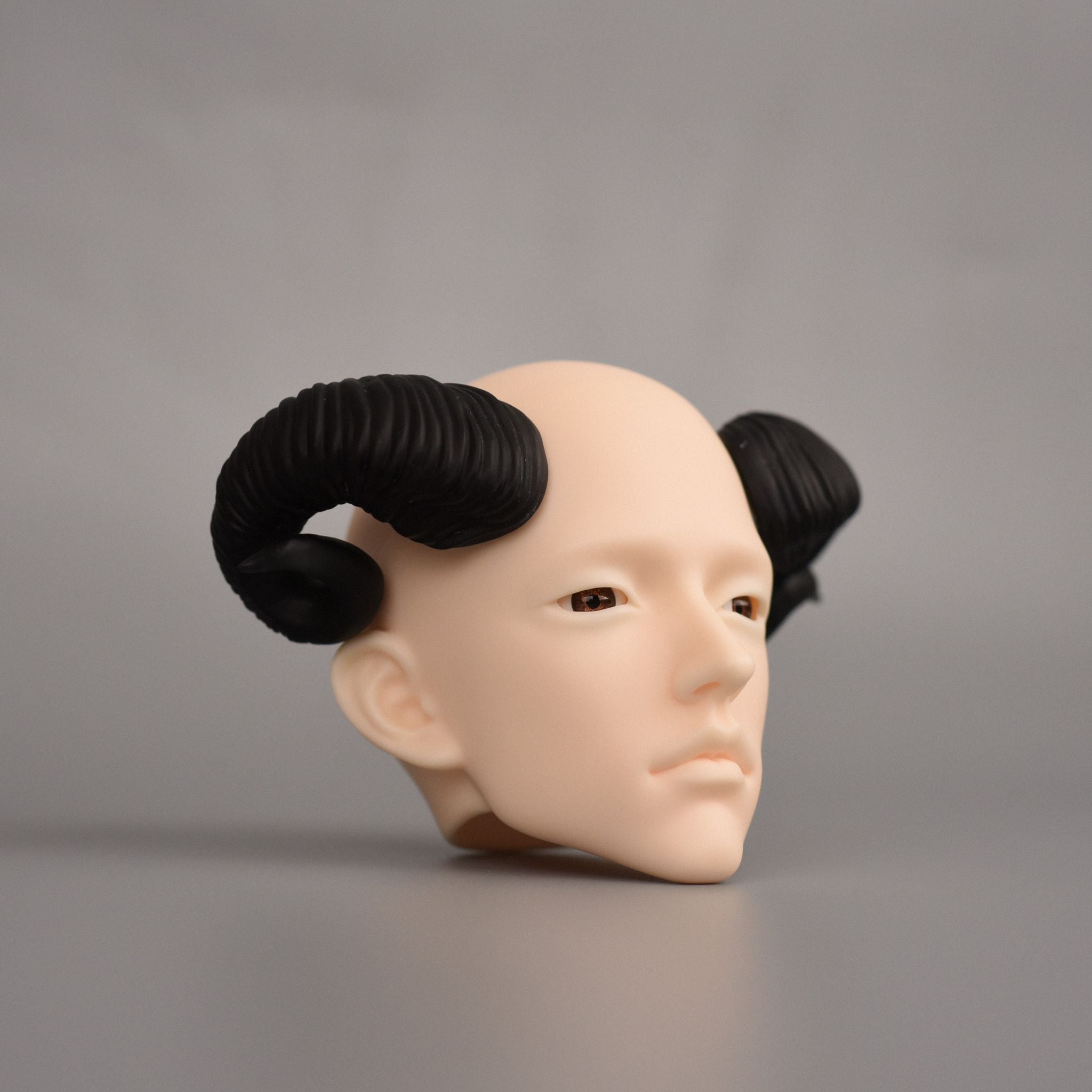 BJD doll ram horns accessory installed on doll head, black curved horn styling effect