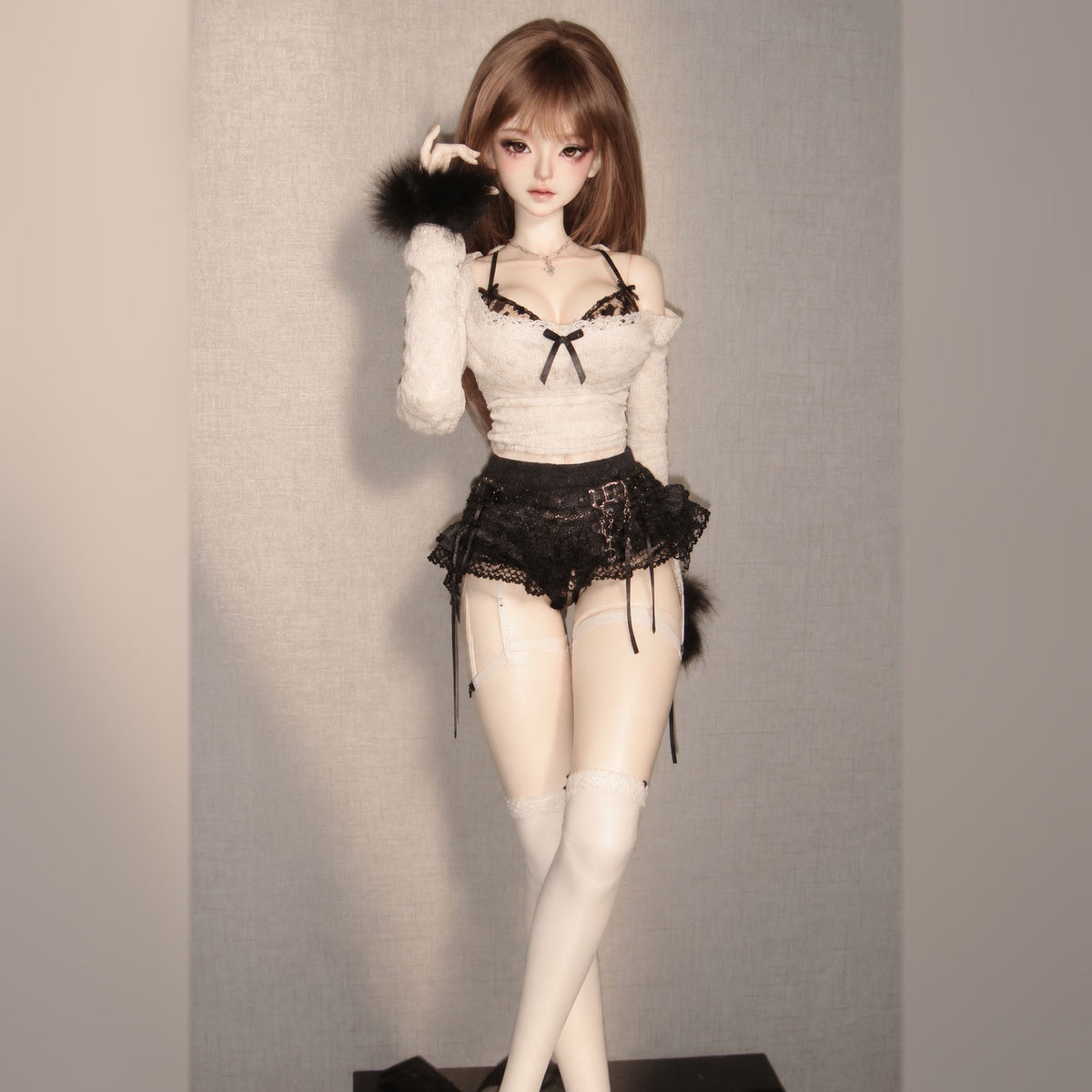 Styled 1/3 scale female BJD display with face-up, brown wig and black lace outfit