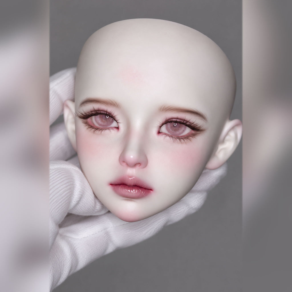 Angled close-up of a pale female BJD head with pink eye makeup, subtle shading and full glossy lips