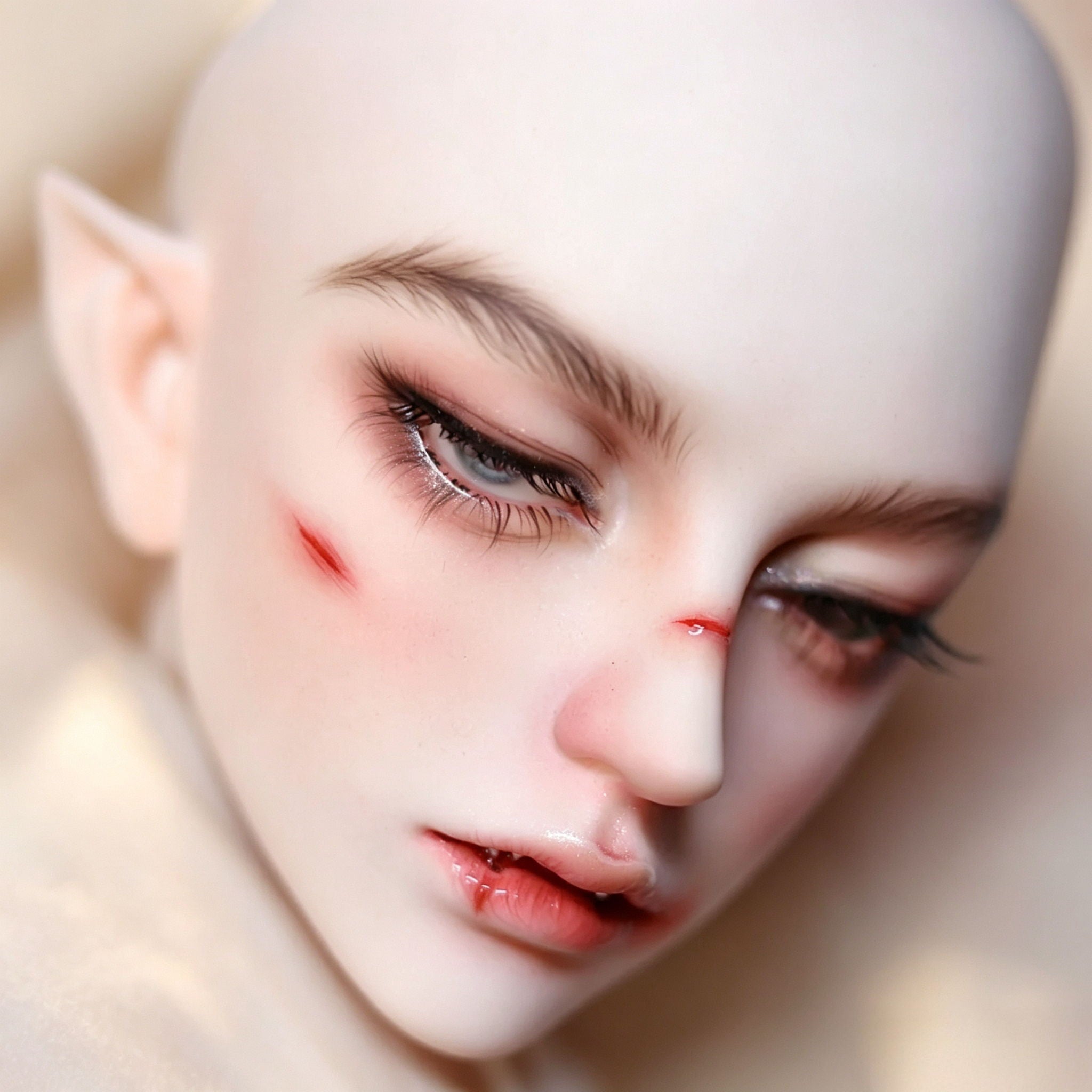 1/3 Scale male BJD head with custom face-up, soft fantasy makeup and side profile view