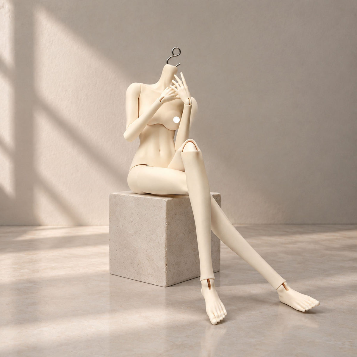 Long-legged female BJD body seated with flexible hip, knee and wrist joints