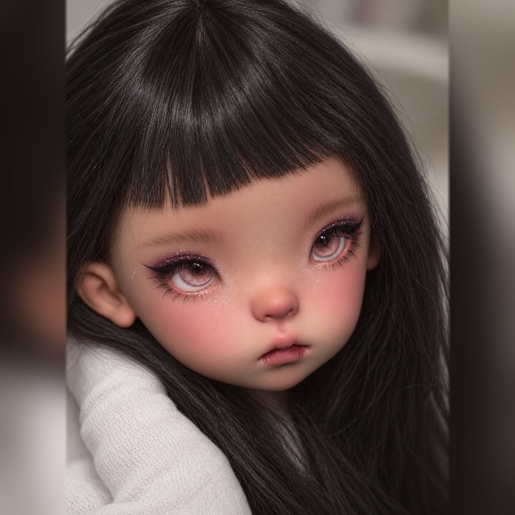 1/6 scale BJD head styled with long dark hair, blunt bangs, pink eyes, glitter makeup and rosy cheeks