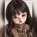 1/6 scale girl BJD head styled with long dark hair, brown eyes, freckles and a soft natural face-up