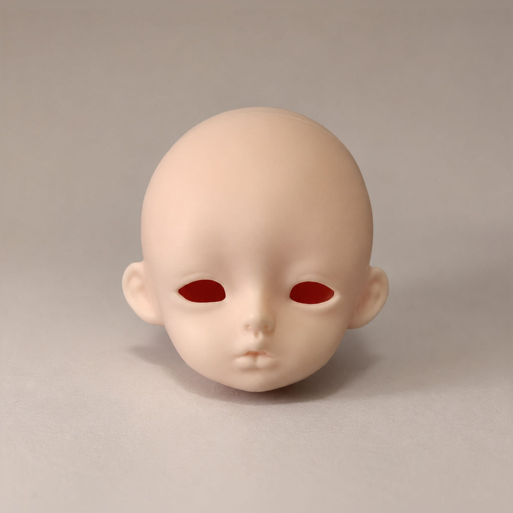Unpainted girl BJD head with large almond-shaped eye openings and softly parted lips