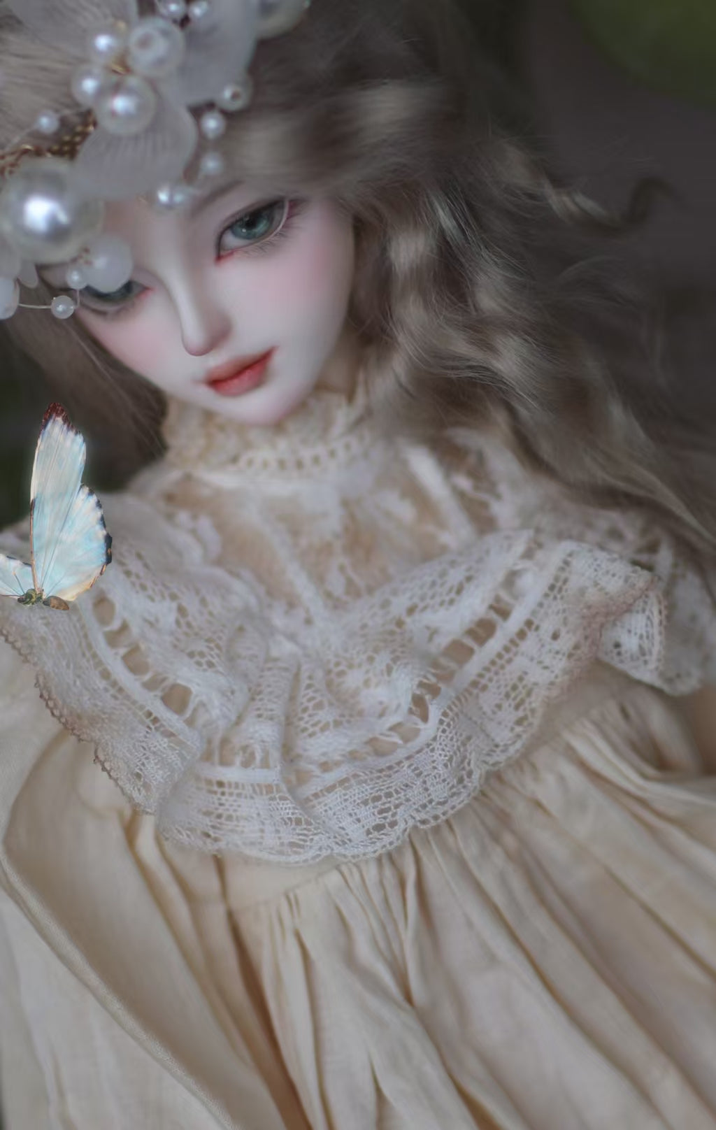 BJD female doll side view showing custom face-up makeup and face sculpt details