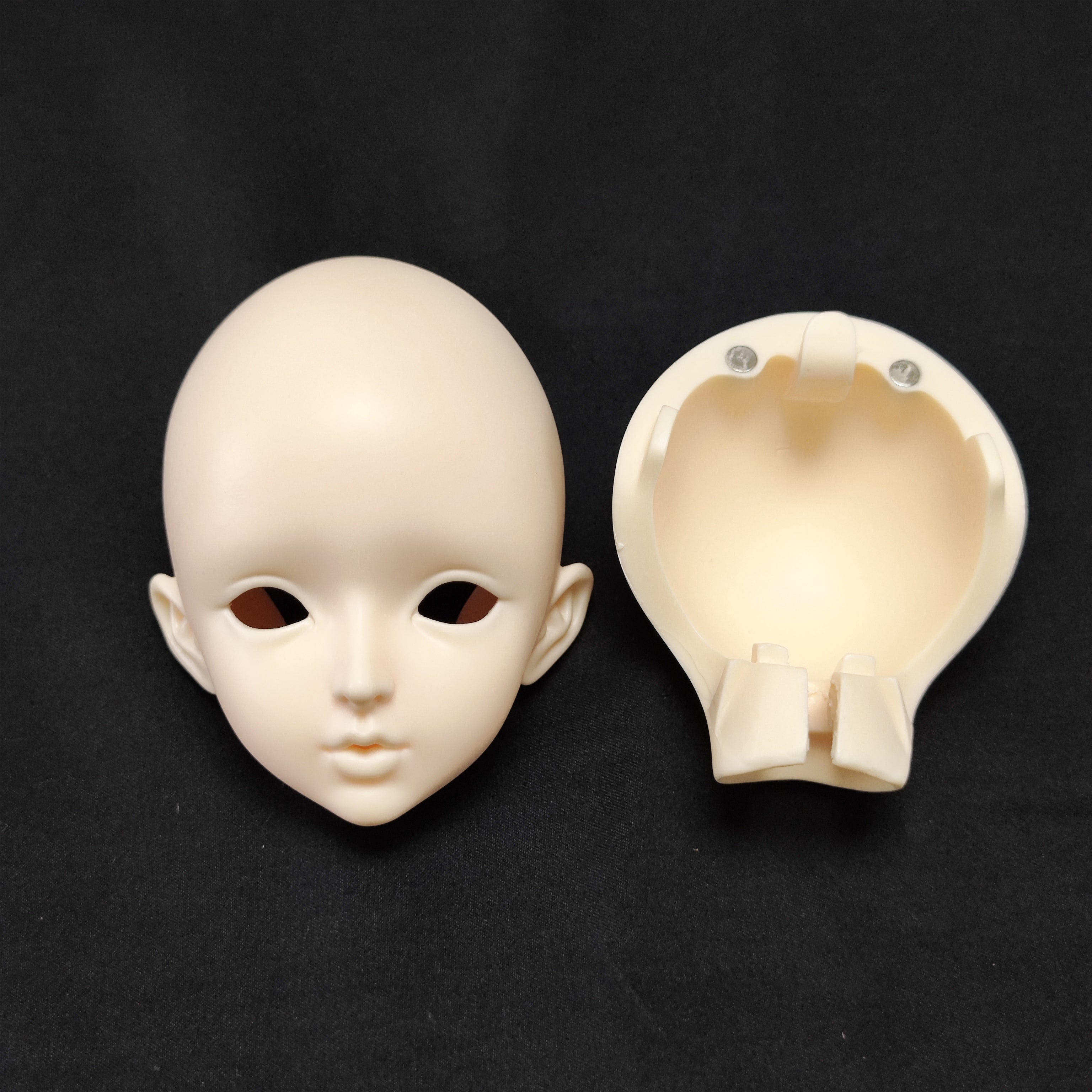 BJD resin doll head shell showing internal structure and head assembly details