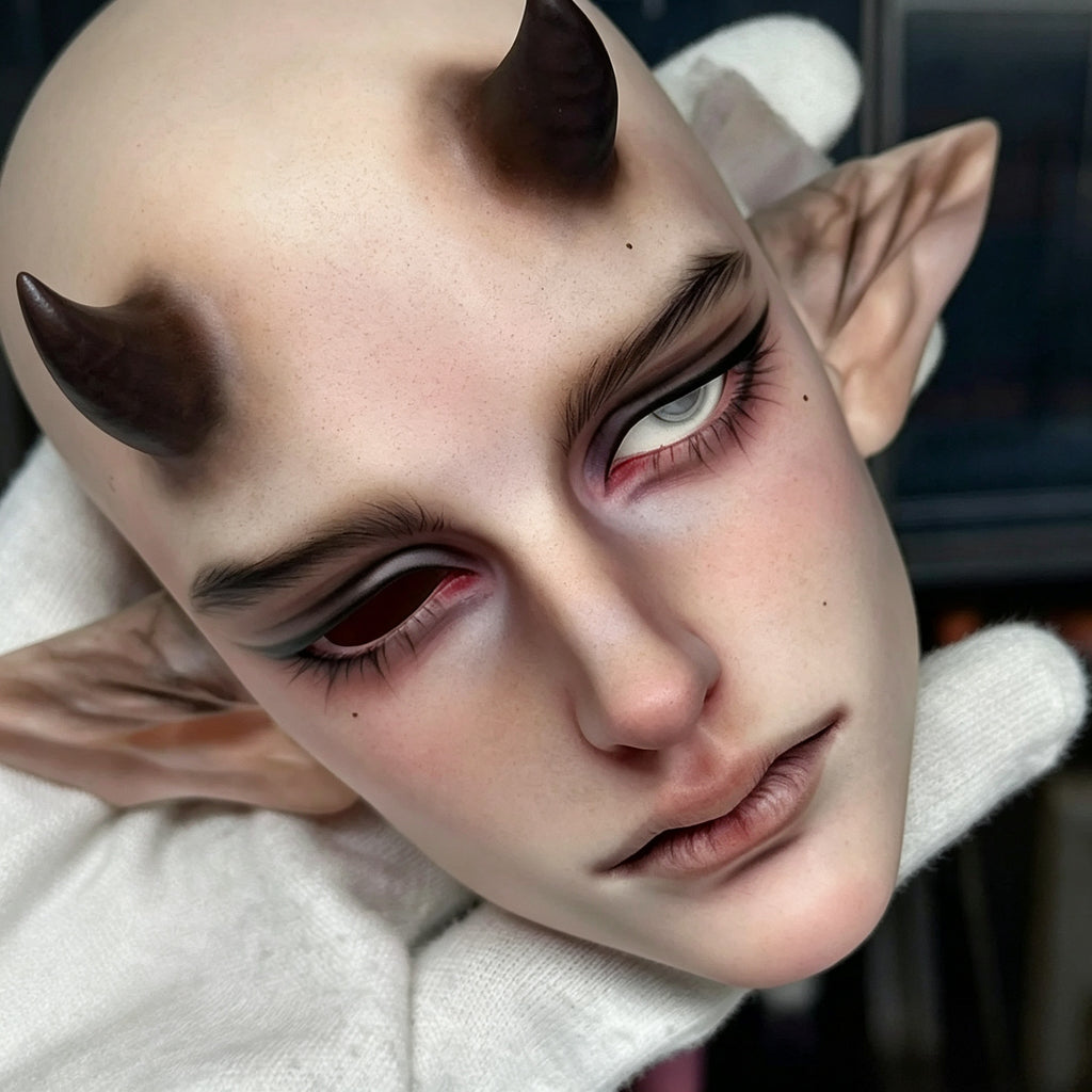 Custom face-up male BJD doll head close-up showing detailed makeup and realistic resin texture
