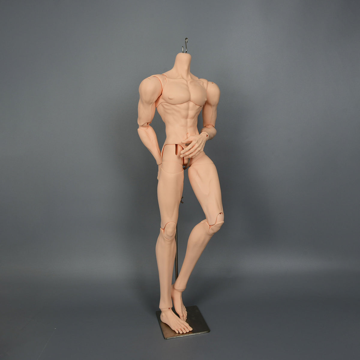 muscular 1/3 scale male BJD body with articulated joints in a dynamic standing pose