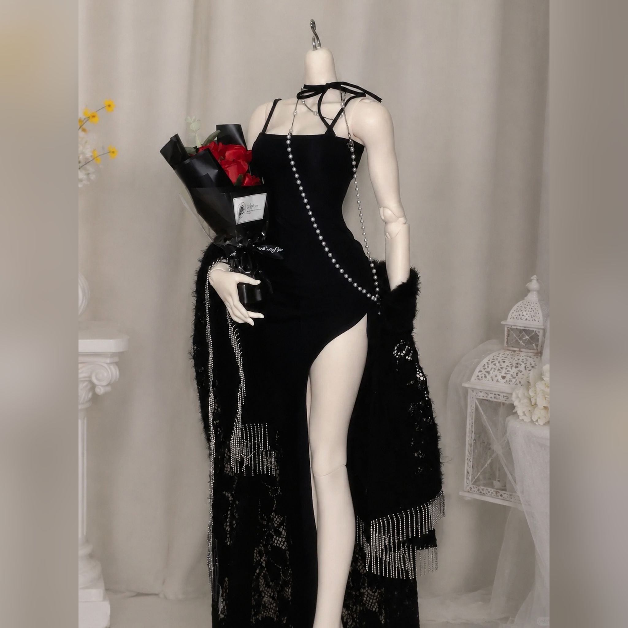 Female BJD doll body wearing an elegant black dress to showcase outfit fitting and articulation