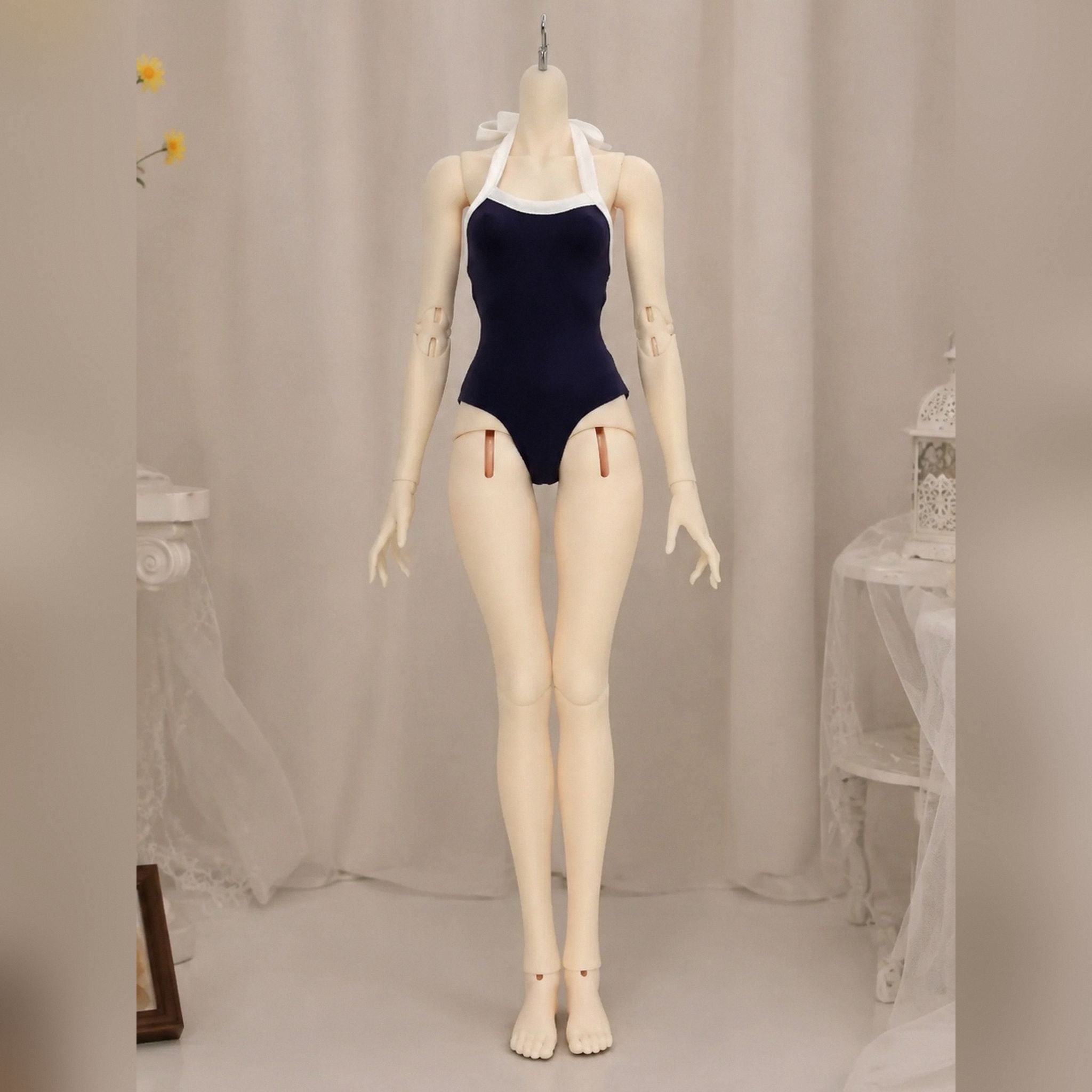 Female BJD doll body wearing a one-piece swimsuit front view for body proportion display