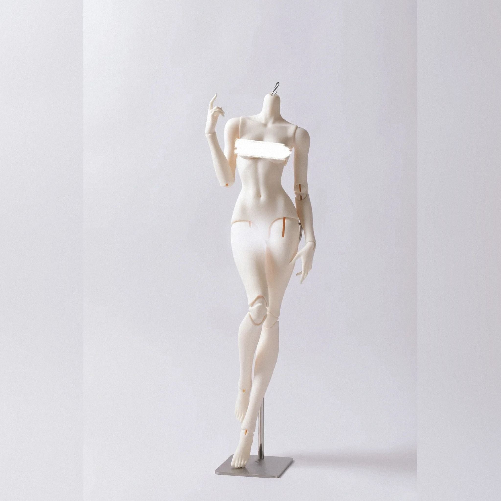 Female resin BJD doll body standing without head to showcase full-body sculpt and articulation