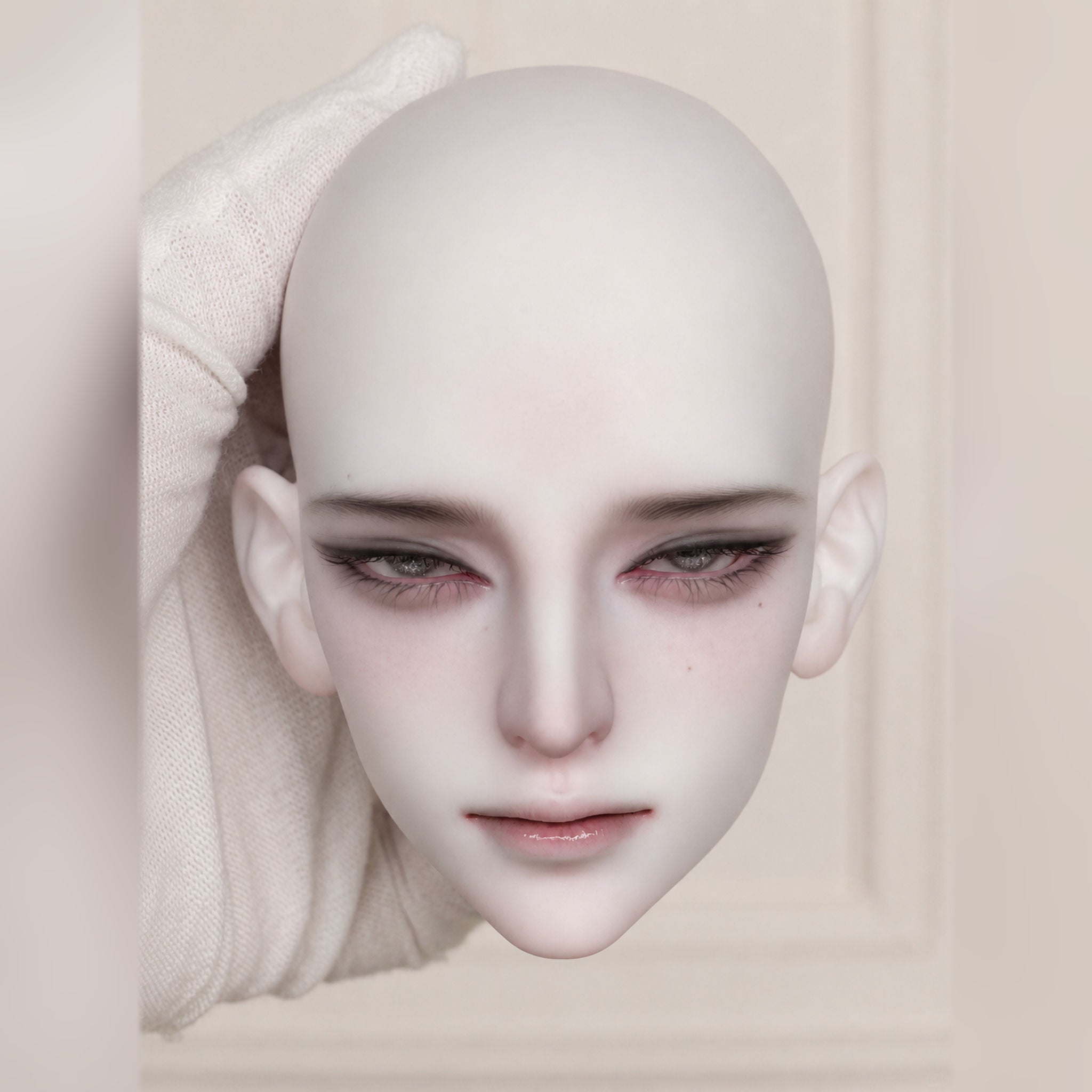 large male BJD head sculpt with custom face-up, white wig styling and delicate fantasy makeup details