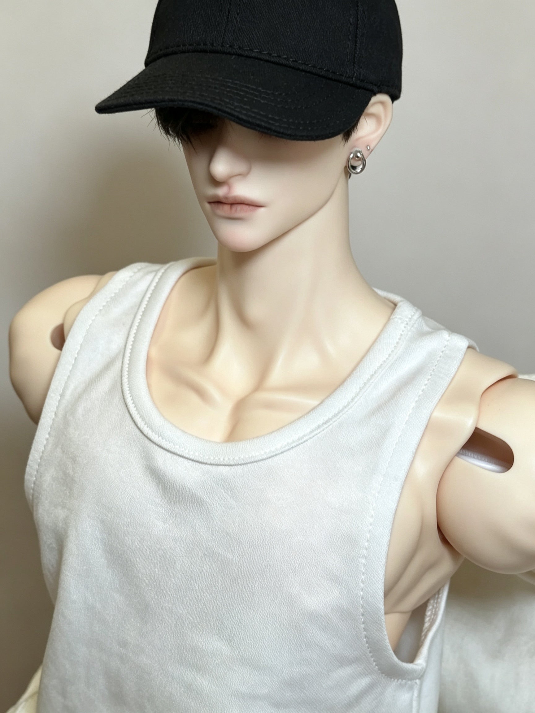 Realistic male BJD body showing sculpted collarbone chest and shoulder details