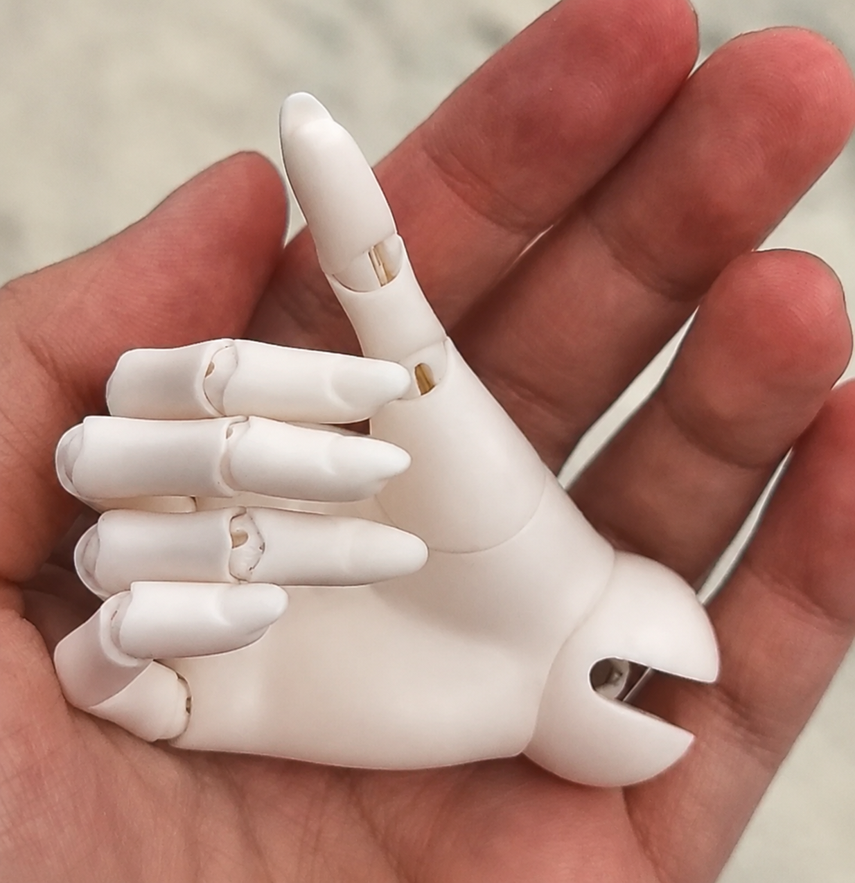Close up of 1/3 scale male BJD articulated hand with realistic finger joints and sculpt details