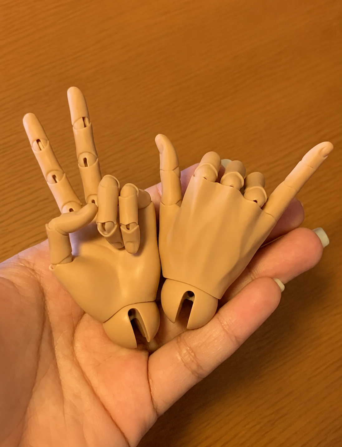 Realistic BJD jointed hands showing front and back sculpt details
