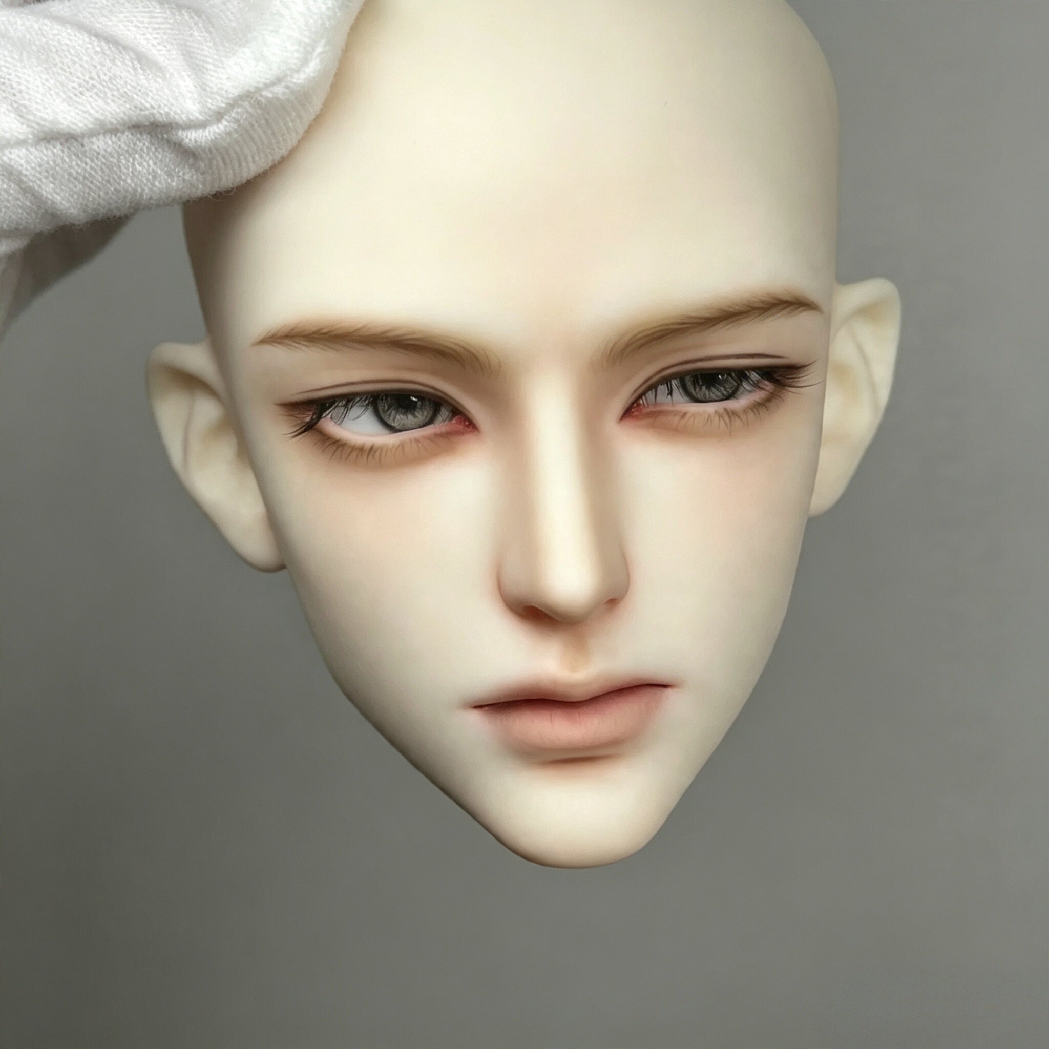 Close-up realistic face-up details on 1/3 male BJD head for customization reference